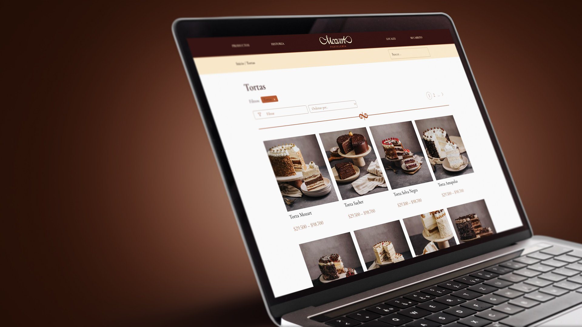 Sitio web de Mozart en un notebook, con la sección de tortas.