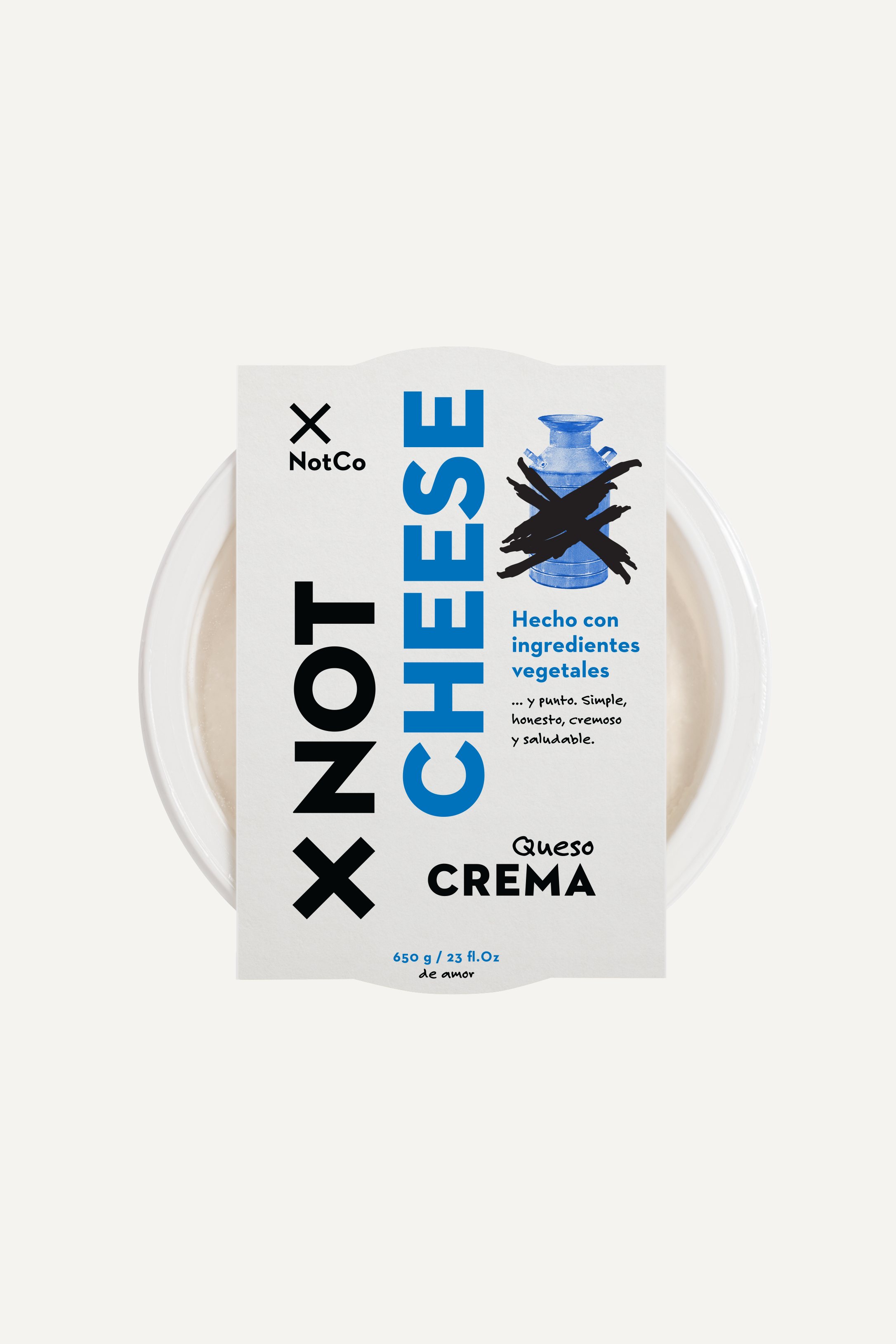 Envase de NotCheese Queso Crema visto desde arriba: NOT en negro, CHEESE en azul y un tarro de leche tachado.