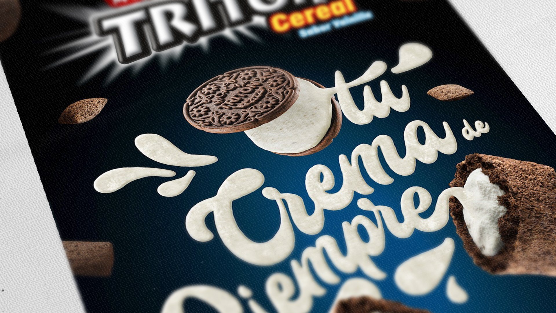 Detalle de la caja de Tritón: lettering «tu crema de siempre» y un pillow abierto.